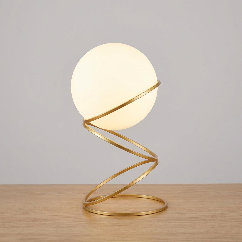 Skulpturale Tischlampe mit spiralförmigem Metallfuß und runder Acrylglaskugel