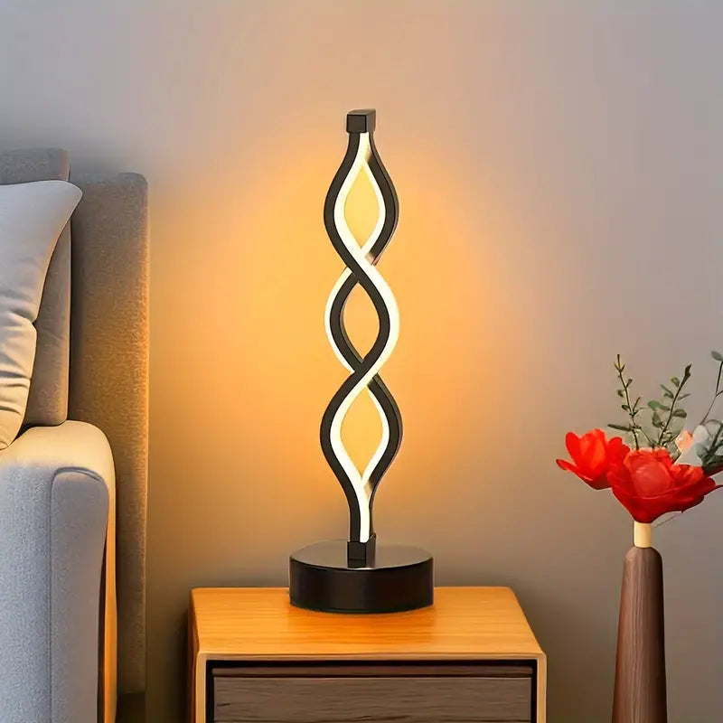 Kompakte skulpturale Tischlampe in Spiralform mit warmem Licht