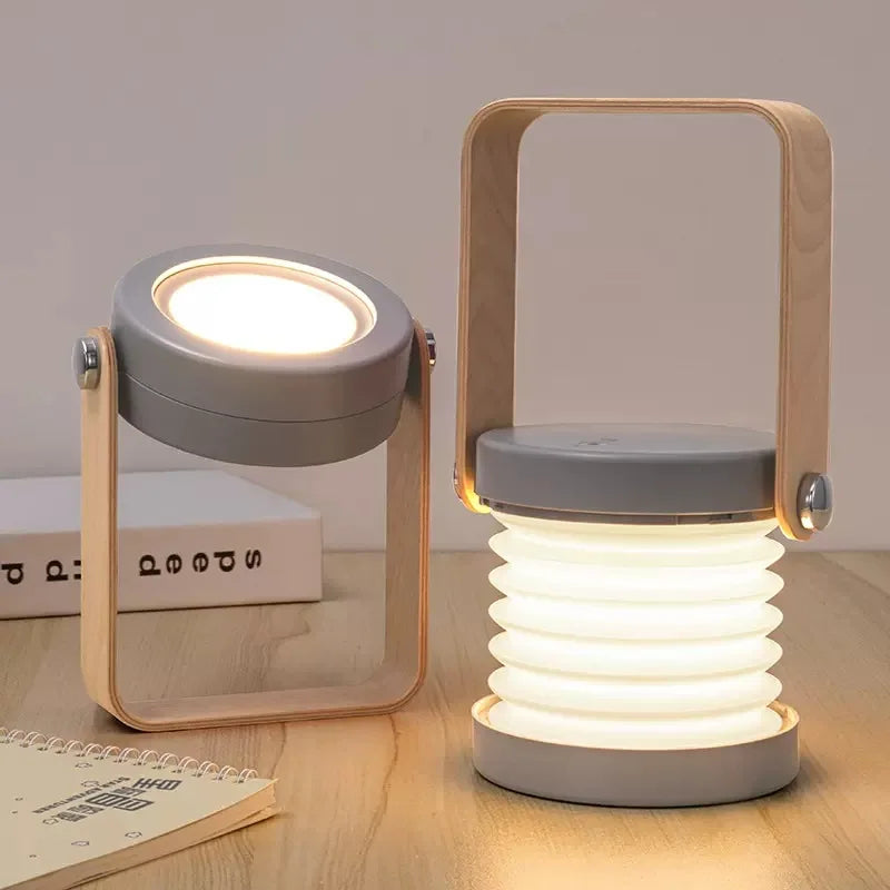 Zusammenklappbare skandinavisch-minimalistische tragbare Tischlampe mit Holzgriff, Akku und Ladefunktion