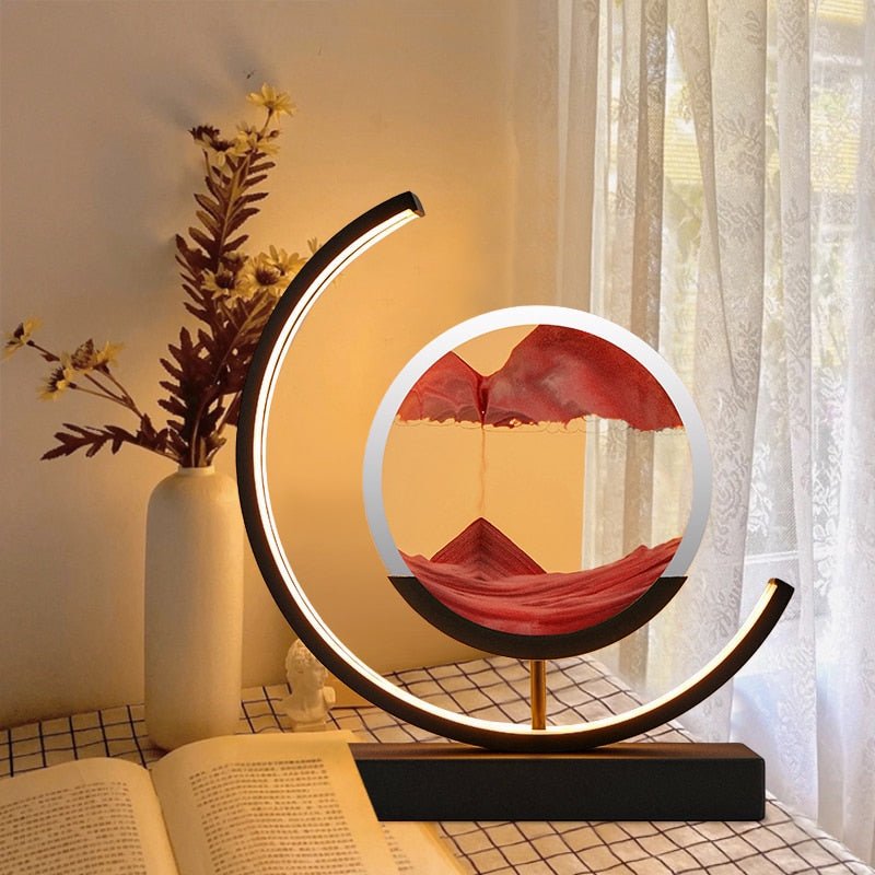 Tischlampe mit rotierender Sandkunst-Skulptur und stimmungsvoller Beleuchtung