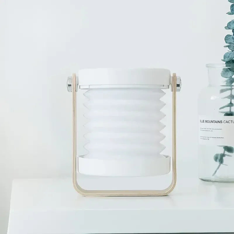 Zusammenklappbare skandinavisch-minimalistische tragbare Tischlampe mit Holzgriff, Akku und Ladefunktion